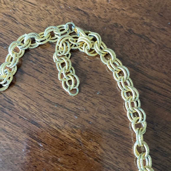 Gold tone charm necklace. Adjustable length. Great condition. - Picture 7 of 10